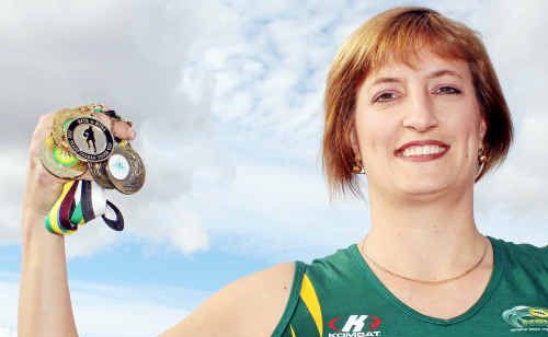 Australian touch rugby captain Tanya Wright with some of her medals from state and national success. Australian touch rugby captain Tanya Wright with some of her medals from state and national success.